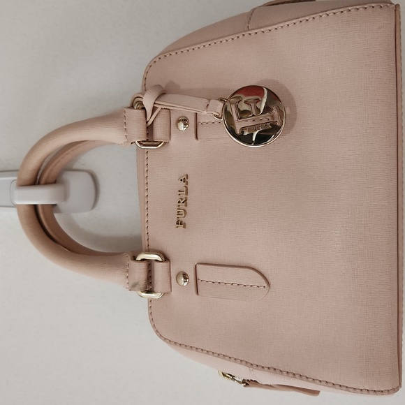 Furla Handbags - #493 FURLA Powder pink mini w/strap. Preloved item sold as is